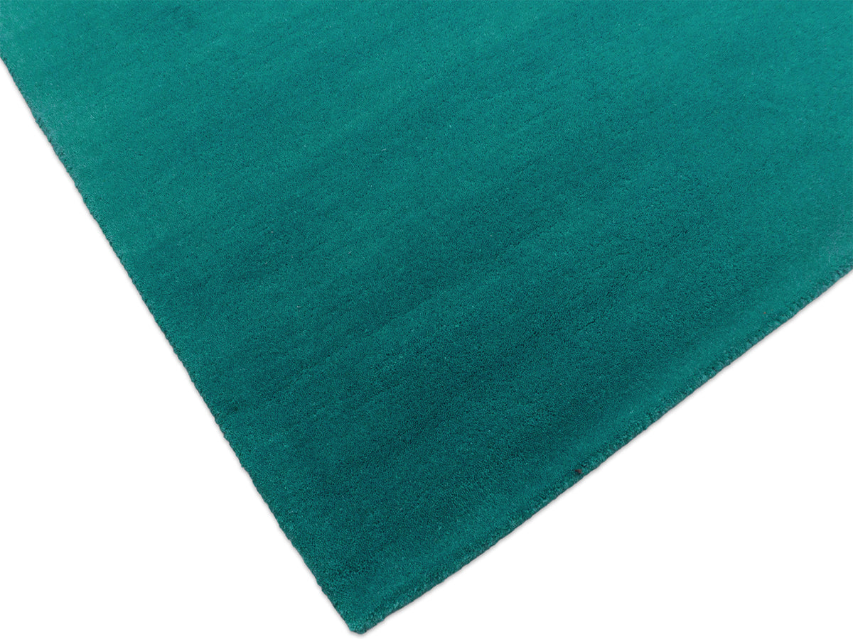 Teal solid wool rug for living room or bedroom, handmade in India