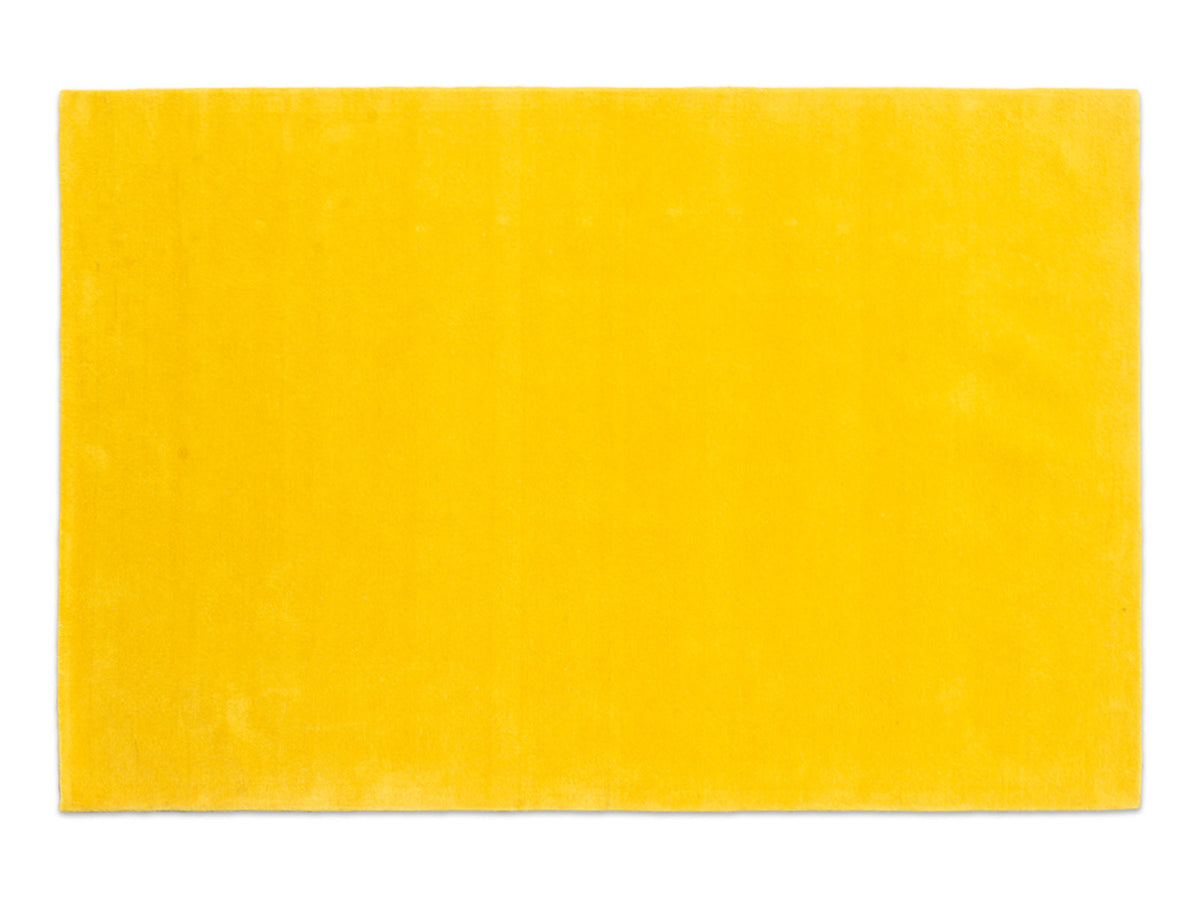 Handmade sunflower yellow solid wool area rug, minimalist style, made in India