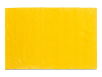 Handmade sunflower yellow solid wool area rug, minimalist style, made in India