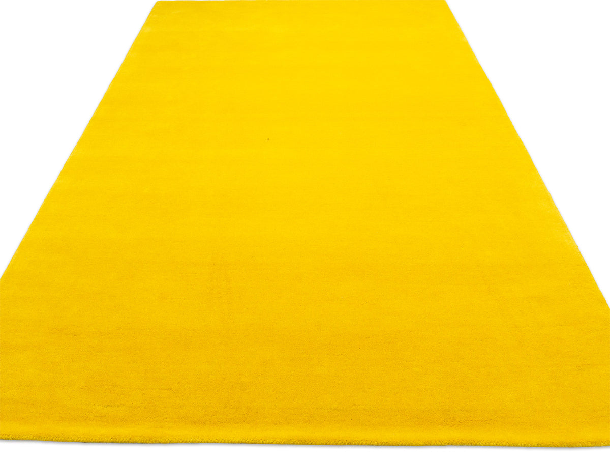 Sunflower yellow solid rug – handmade minimalist wool rug by Bodhi Artisans