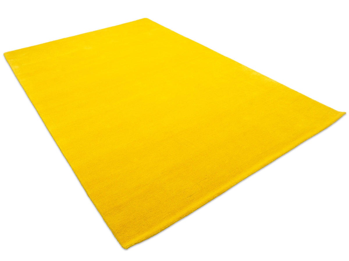 Minimalist sunflower yellow solid area rug, handmade wool rug from India