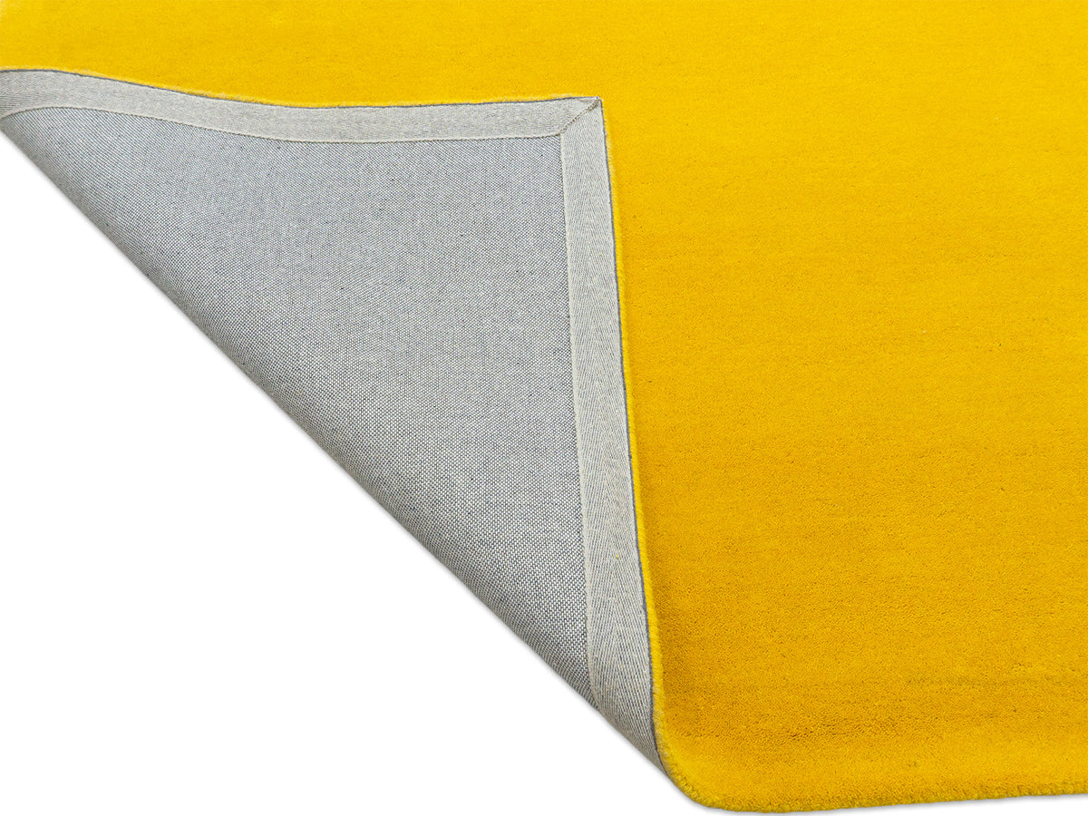 Sunflower yellow solid wool rug for living room or bedroom, handmade in India