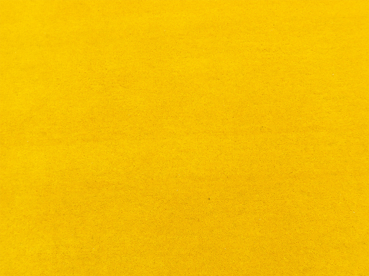 Handmade sunflower yellow solid wool area rug, minimalist style, made in India – photo 7