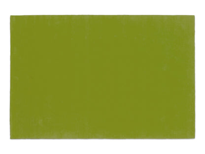Handmade lime green solid wool area rug, minimalist style, made in India