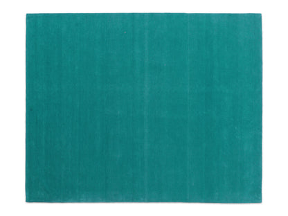 Handmade teal solid wool area rug, minimalist style, made in India
