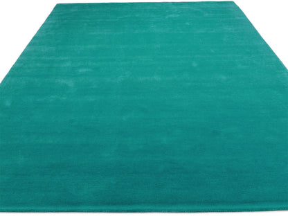 Teal solid rug – handmade minimalist wool rug by Bodhi Artisans