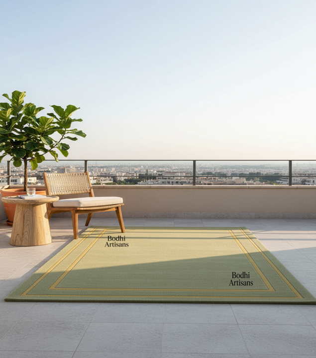 Elegant sage green handmade wool rug with minimalist border design. A modern luxury area rug perfect for living rooms, bedrooms, and contemporary homes.