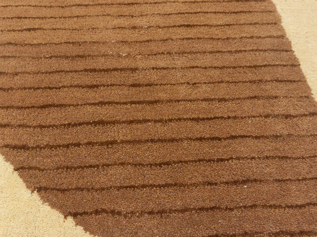 Hand-tufted modern peach gold geometric rug, Bodhi Artisans wool area rug